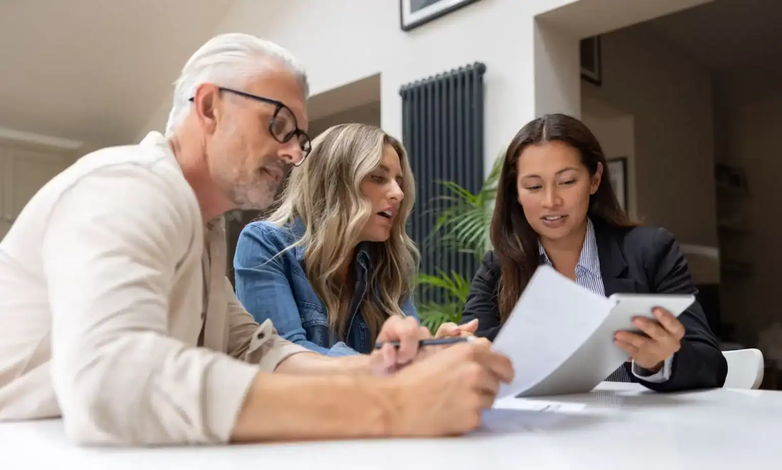 Couple consulting with a personal injury lawyer during legal case review.