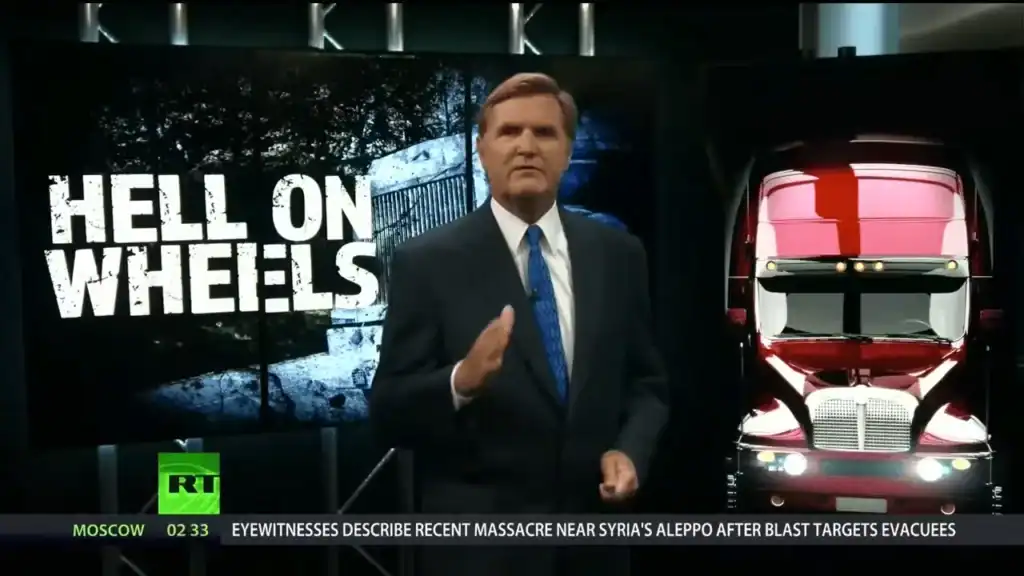 News anchor presenting segment titled Hell on Wheels about trucking accidents and highway dangers.