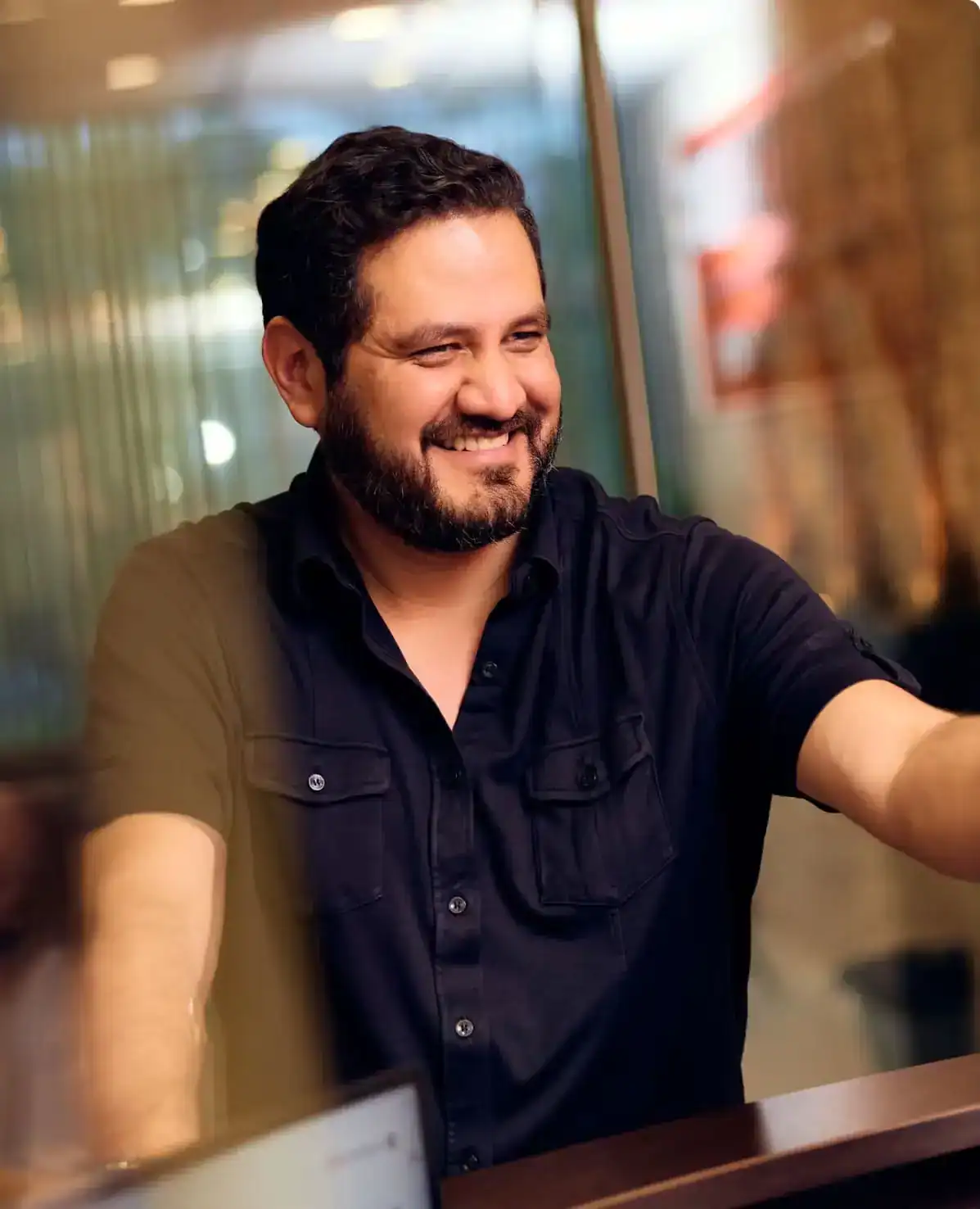 Happy client shaking hands with Houston personal injury lawyer at Stewart J Guss law office