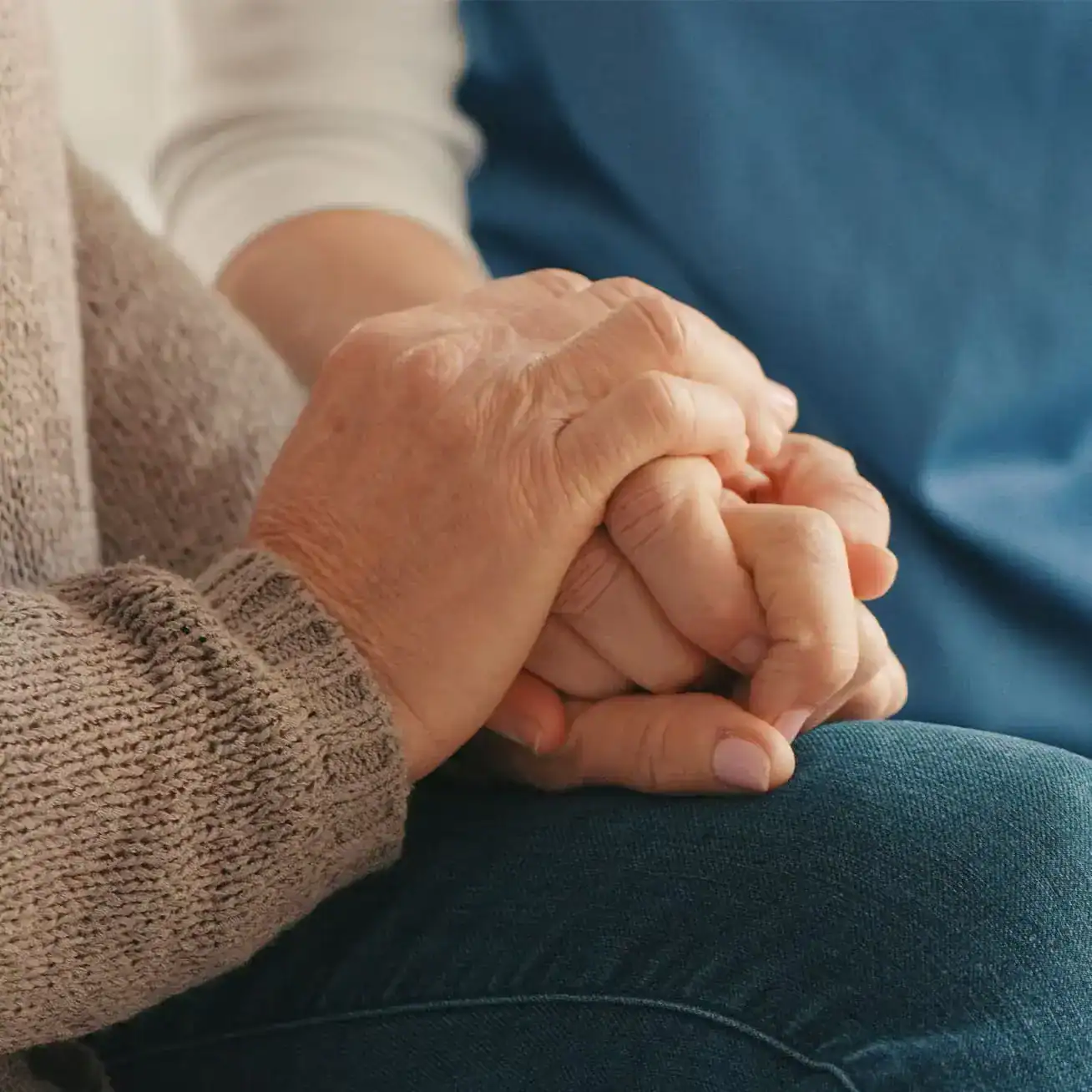 Houston wrongful death lawyer offering compassion and support to grieving family holding hands