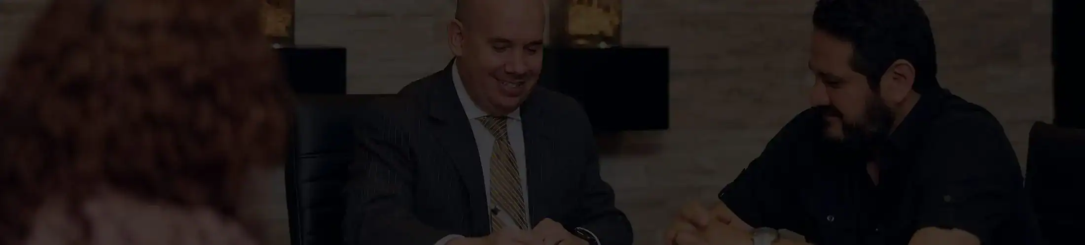 Houston personal injury lawyer meeting with client to review legal documents and discuss case details