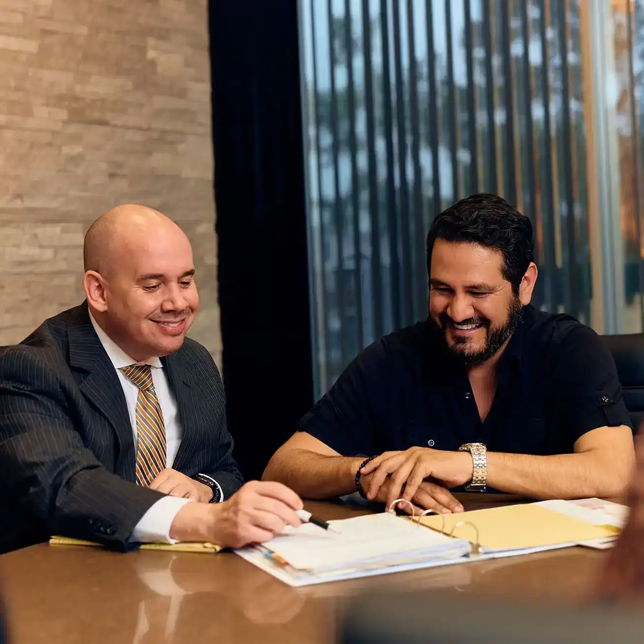 Personal injury lawyer discussing legal documents with a client during consultation