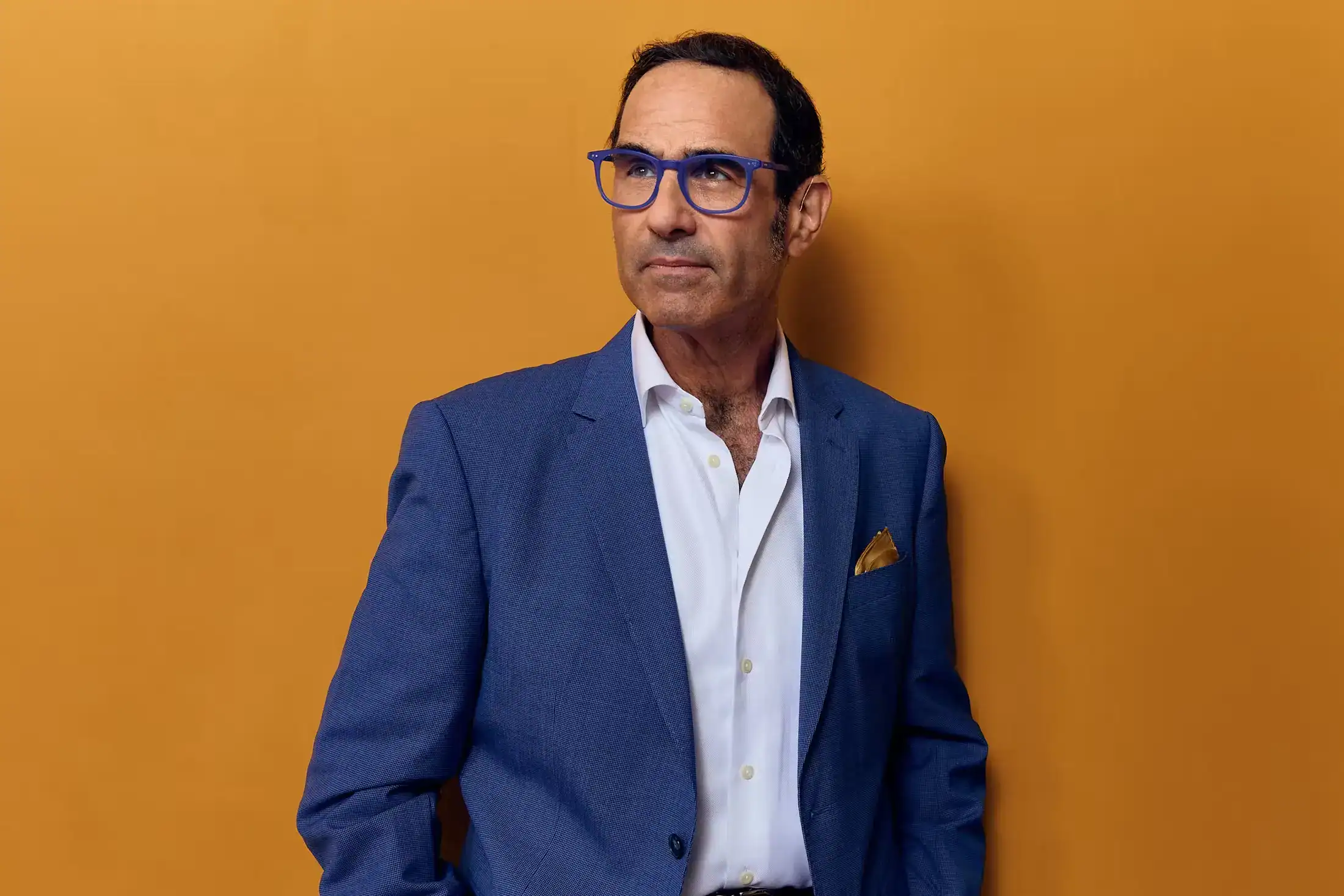 Portrait of Stewart J. Guss personal injury lawyer in blue suit and glasses