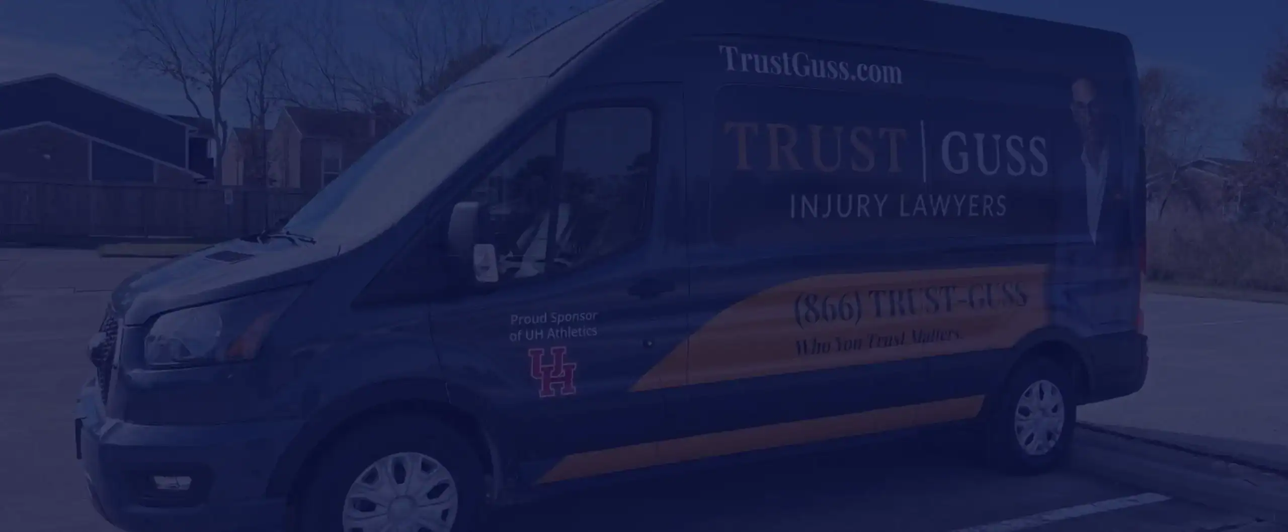 Stewart J. Guss Injury Lawyers branded van with University of Houston Athletics sponsorship logo and contact information