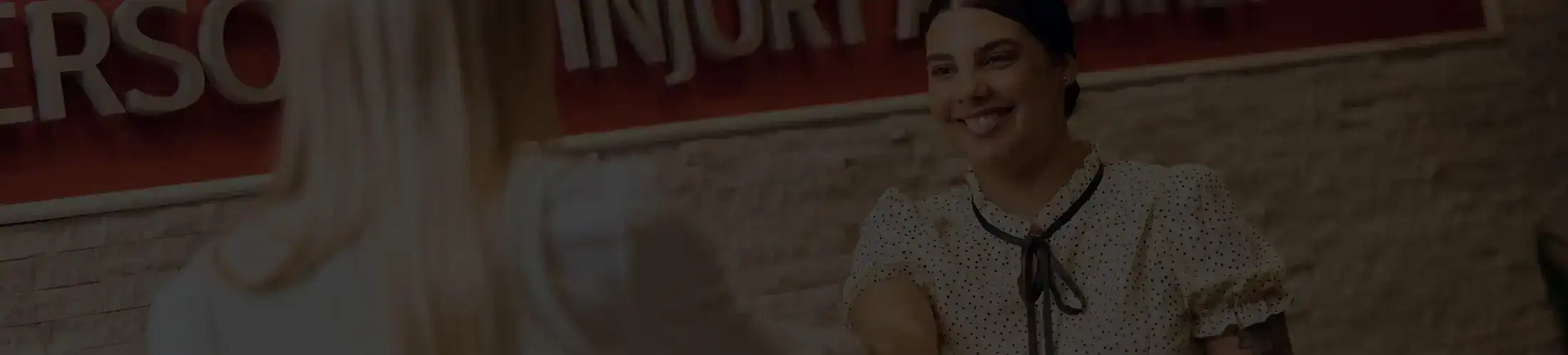 Client welcomed with handshake by Stewart J. Guss Injury Lawyers staff at office reception