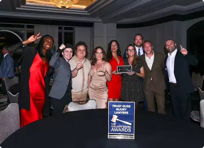 Trust Guss Injury Lawyers team celebrating Golden Gavel Award achievement