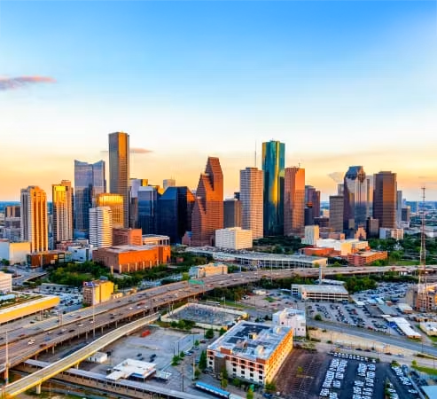 The Houston skyline during mid morning with blue skies and lite clouds.