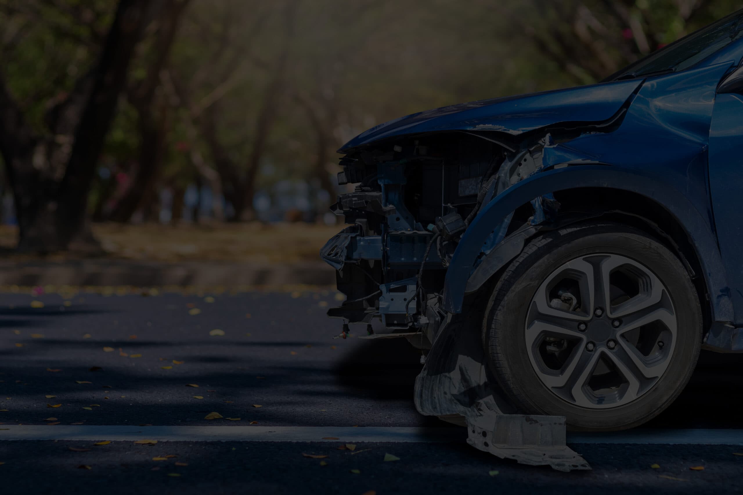A Close Up Of A Blue Car With It S Bumper Knocked Off