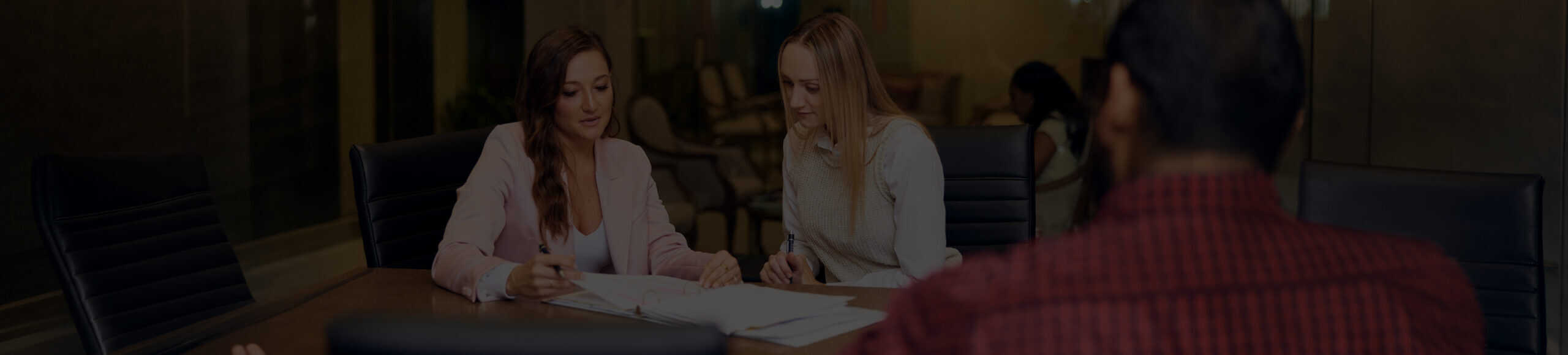 Trust Guss Lawyer With A Client Sitting At A Desk