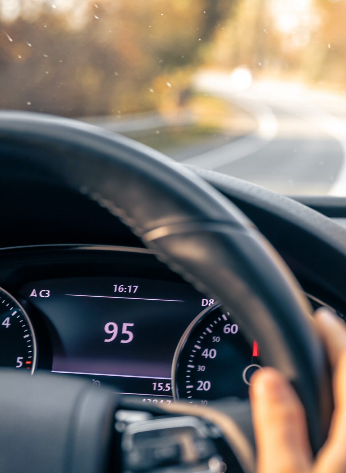 Steering Wheel In A Car Close Up High Speed Driving On The Road