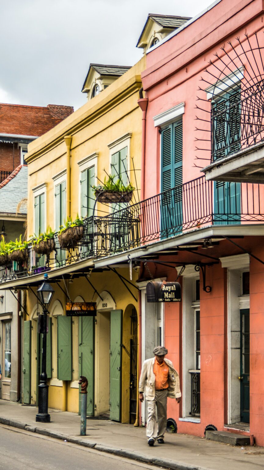 Man Walking Down A Street In New Orleans